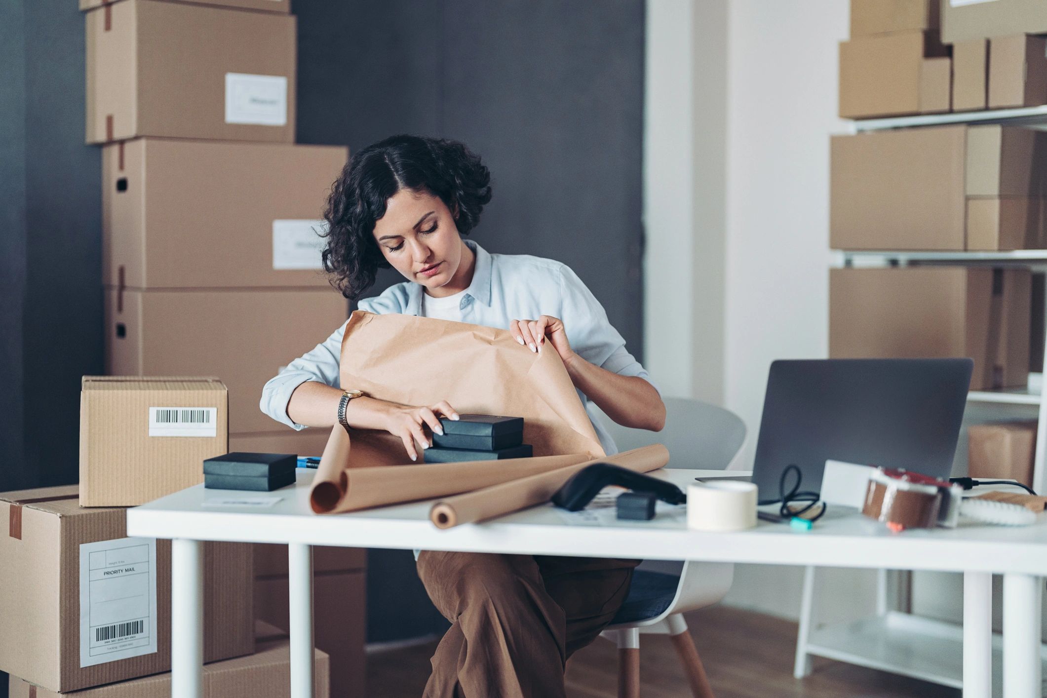 Small business owner preparing a shipment package