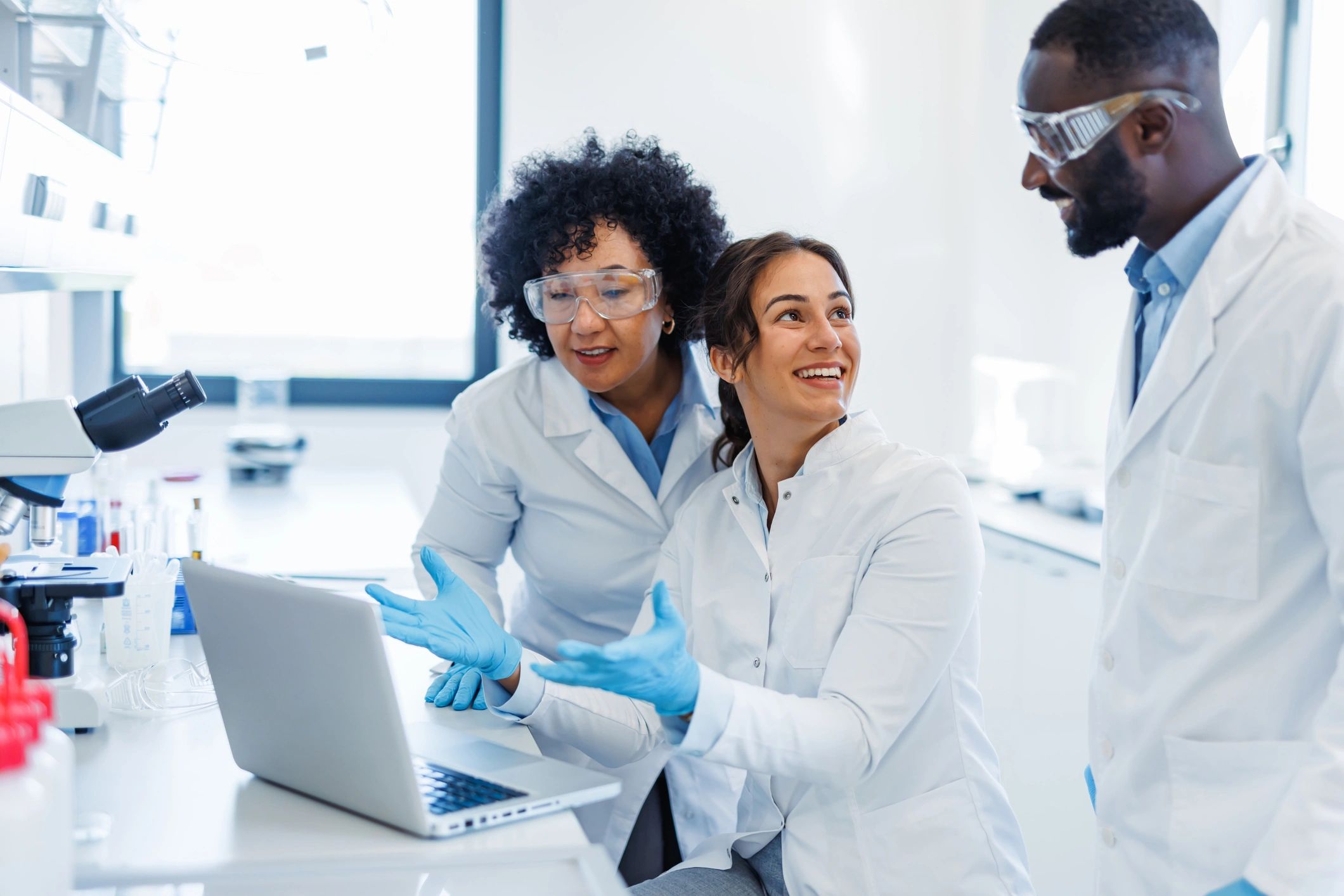 Scientists reviewing results together in a laboratory